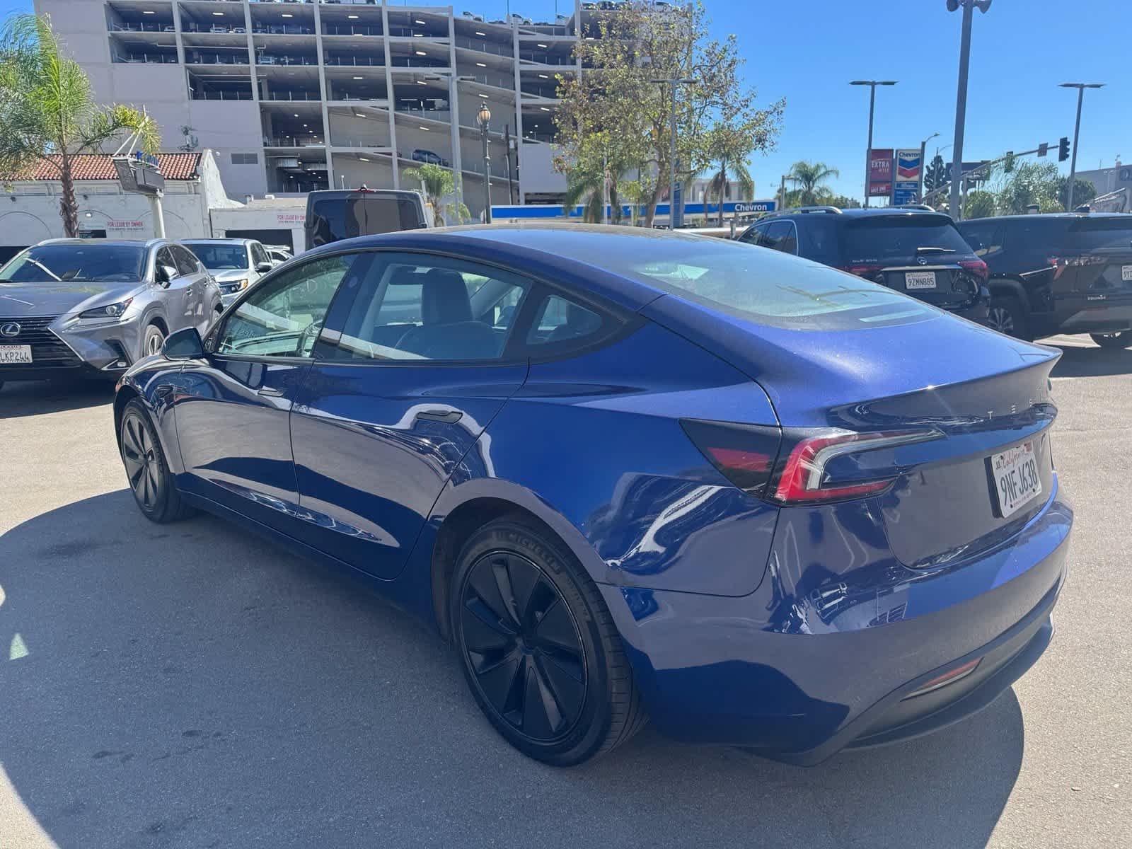 Used 2024 Deep Blue Metallic Tesla  image 4