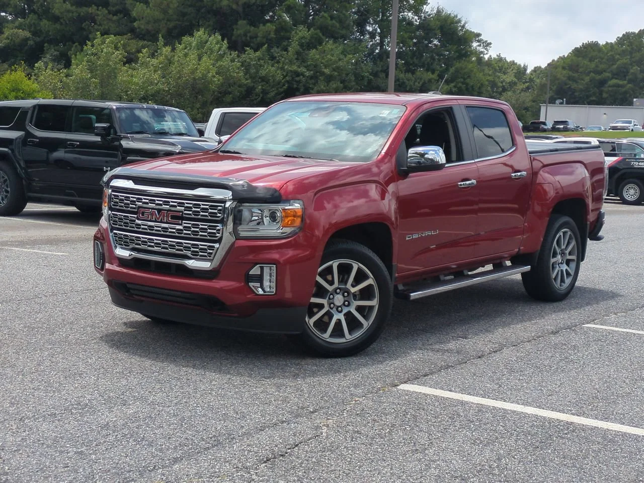 Used 2021 CAYENNE RED TINTCOAT GMC 2WD Denali image 1