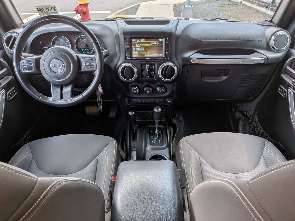 Used 2016 Black Jeep Unlimited Sahara image 17