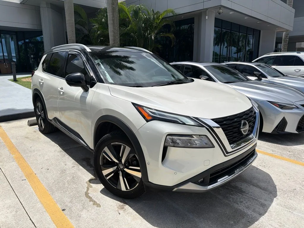 Used 2021 Pearl White Tricoat/Super Black Nissan Platinum image 1