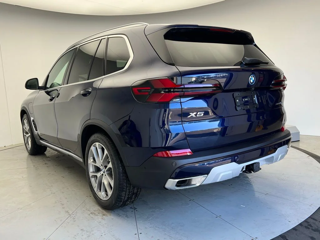 Used 2026 Tanzanite Blue II Metallic BMW xDrive50e image 4