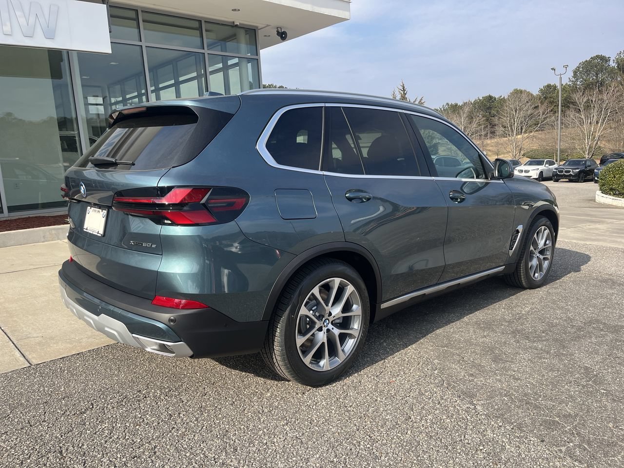 Used 2026 Blue Ridge Mountain Metallic BMW xDrive50e image 8