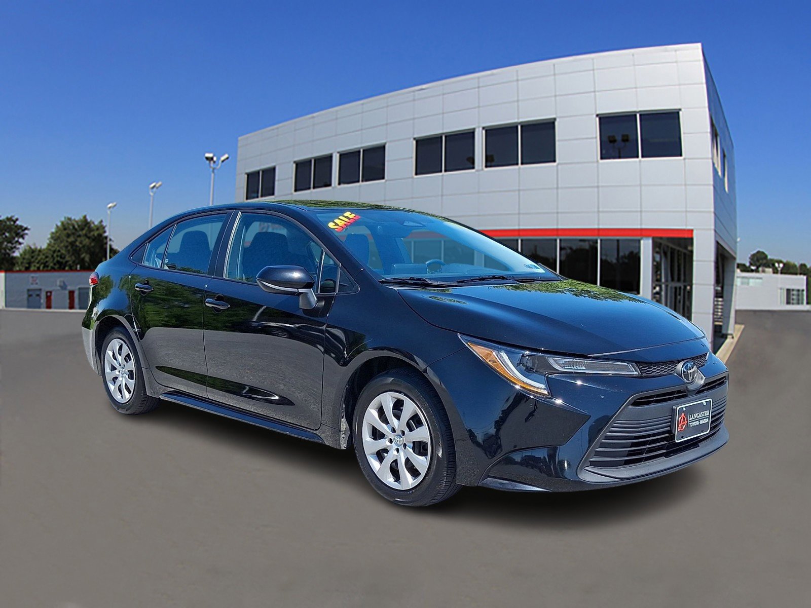 Used 2025 Midnight Black Metallic Toyota LE image 1