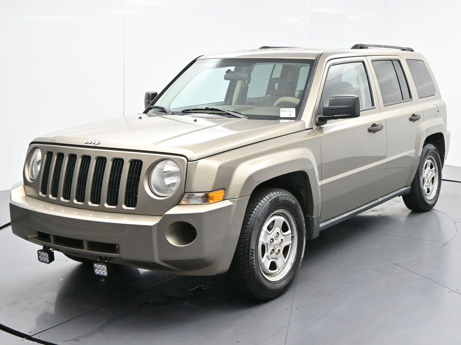 Used 2008 Light Khaki Metallic Jeep Sport image 3