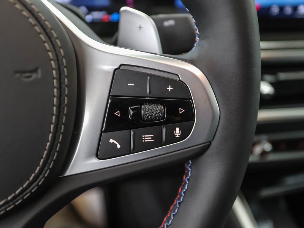 Used 2026 Black Sapphire Metallic BMW M60i image 13
