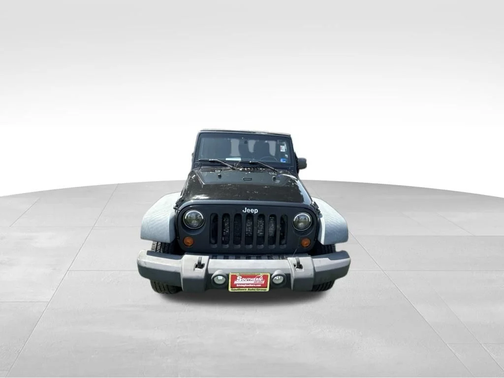 Used 2012 Black Jeep Unlimited Sport image 10