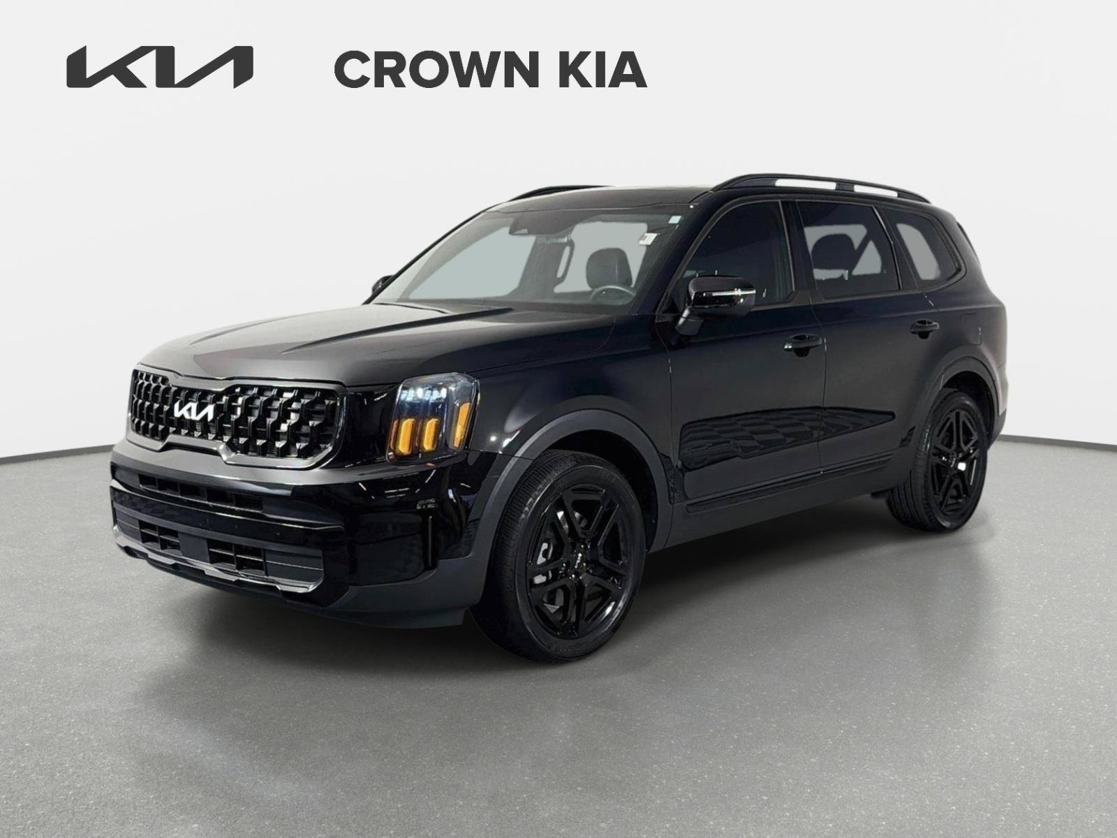 Used 2024 Ebony Black Kia EX X-Line image 1