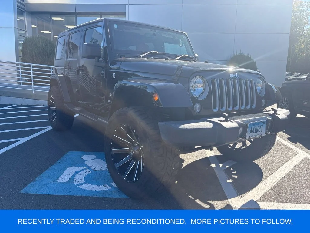 Used 2018 Black Jeep Unlimited Sahara image 1