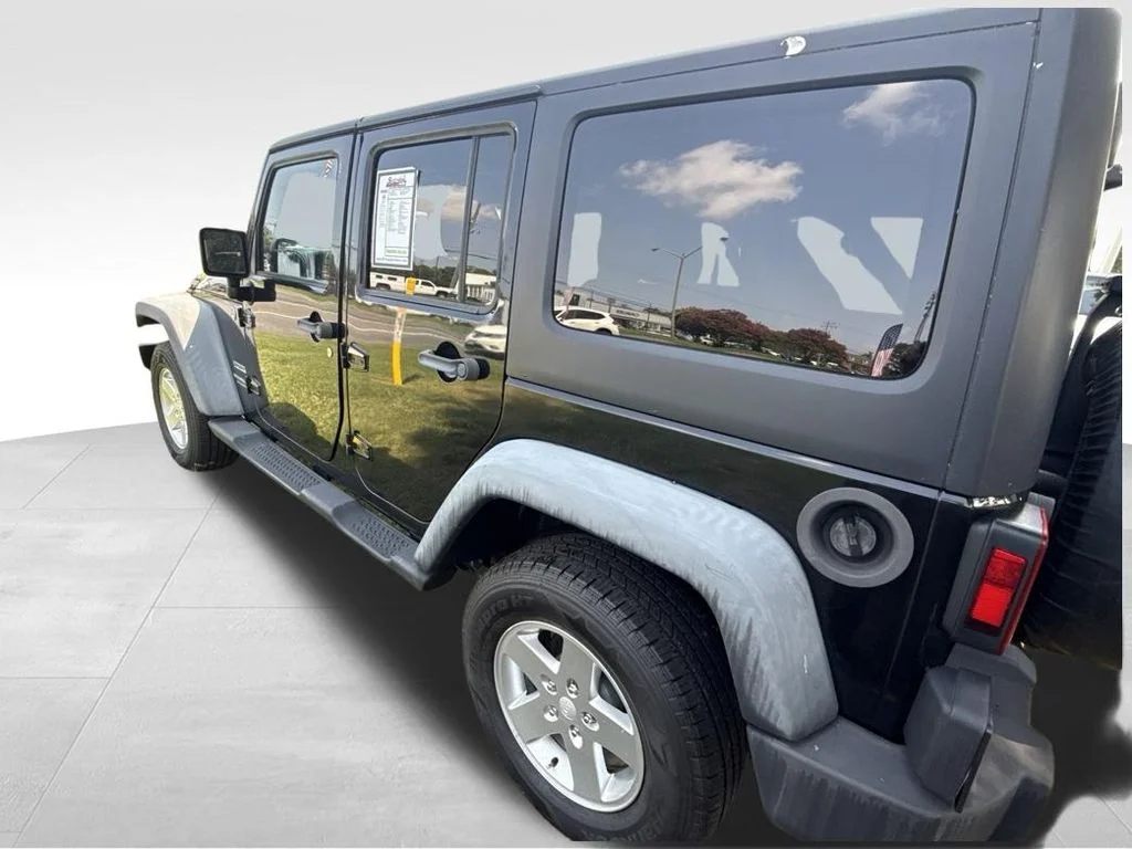 Used 2012 Black Jeep Unlimited Sport image 3