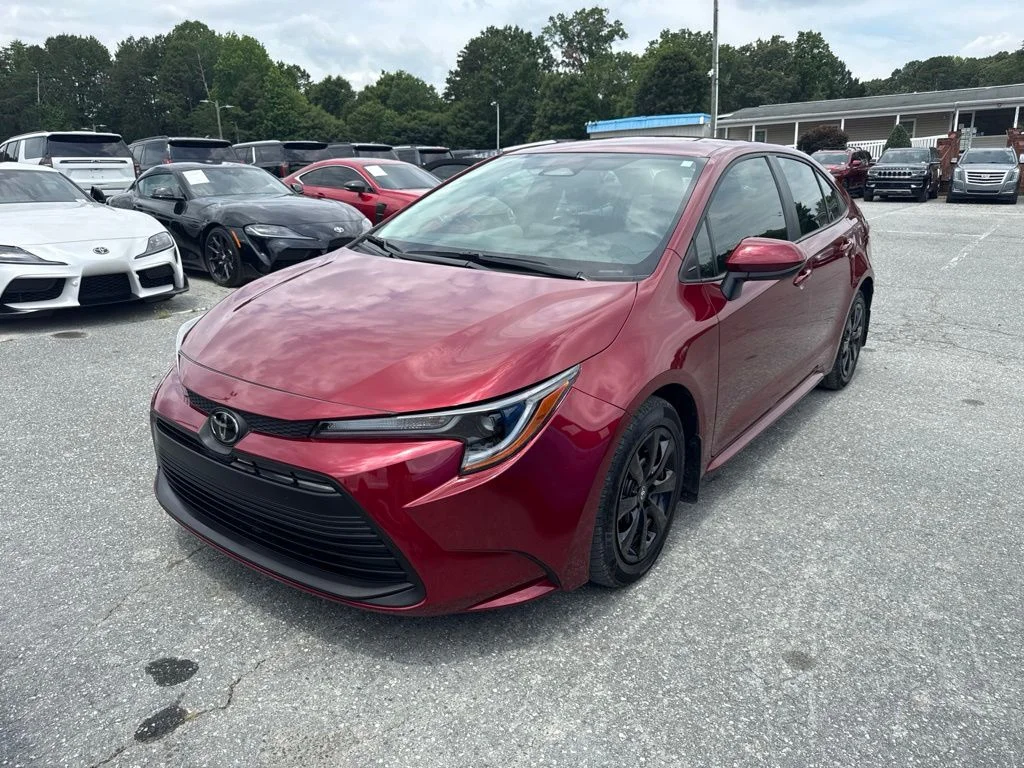 Used 2025 Red Toyota LE image 1