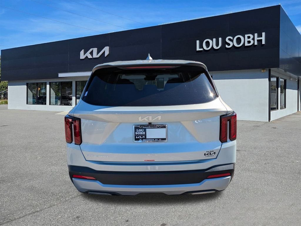 New 2026 Ivory Silver Kia LX image 4