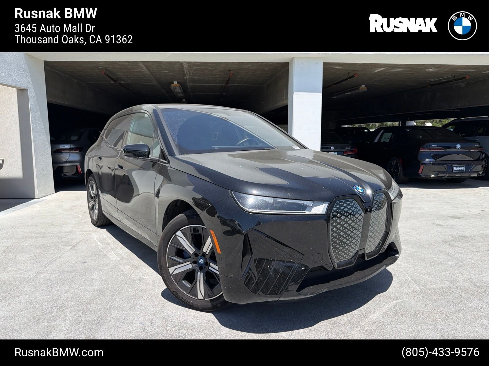 Used 2024 Black Sapphire Metallic BMW xDrive50 image 1