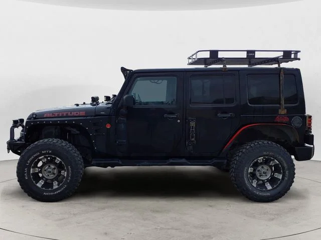 Used 2012 Black Jeep Unlimited Sahara Altitude image 2