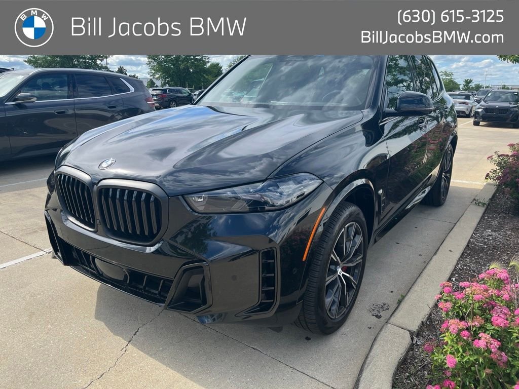 Certified Used 2024 Black Sapphire Metallic BMW xDrive40i image 1