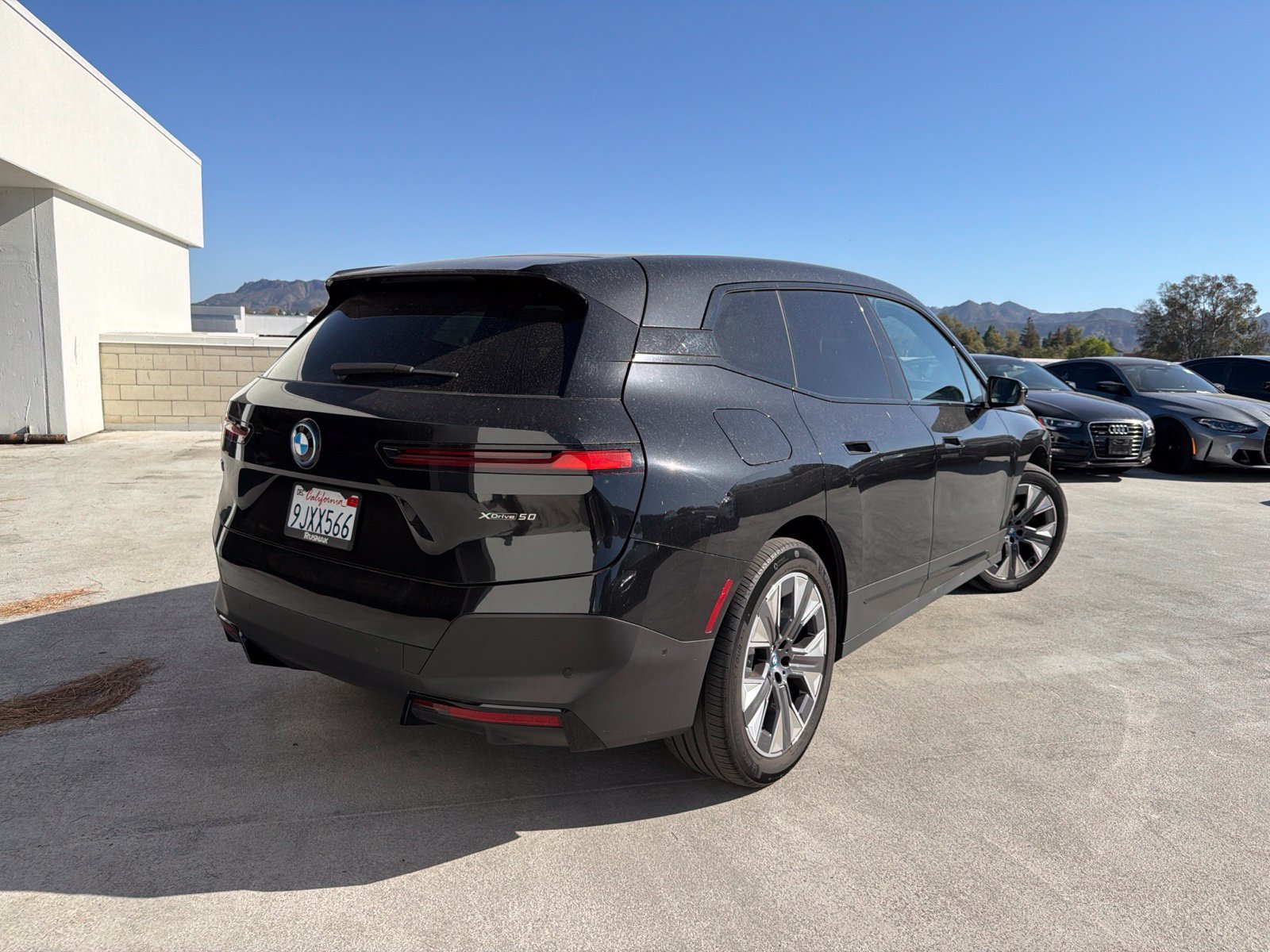 Used 2024 Black Sapphire Metallic BMW xDrive50 image 4