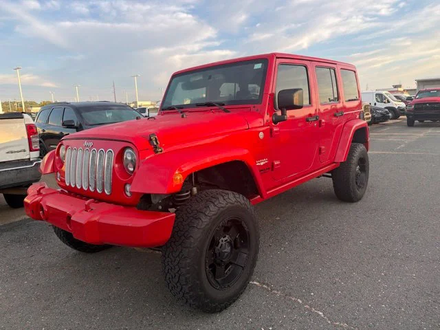 Used 2015 Red Jeep Unlimited Sahara image 2