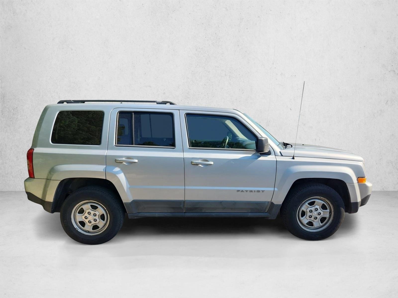 Used 2011 Bright Silver Metallic Jeep Sport image 4