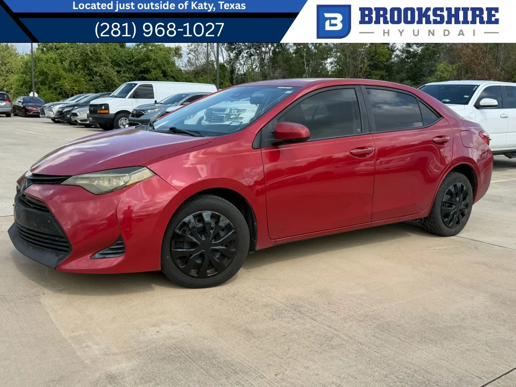 Used 2017 Barcelona Red Metallic Toyota LE image 1