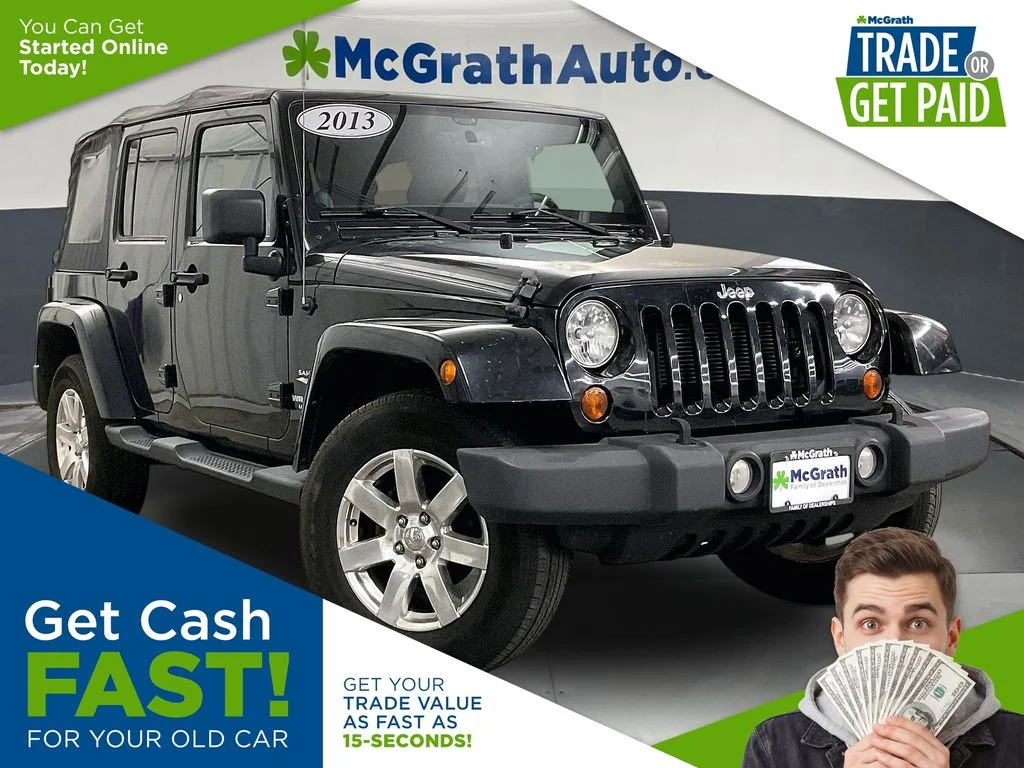 Used 2013 Black Jeep Unlimited Sahara image 1