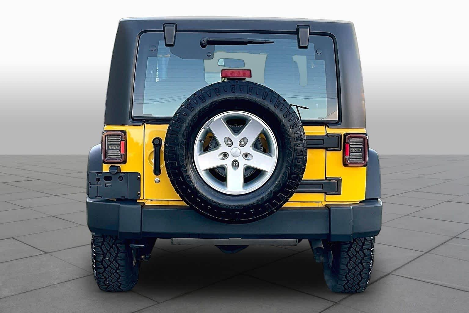 Used 2015 Baja Yellow Clearcoat Jeep Sport image 5