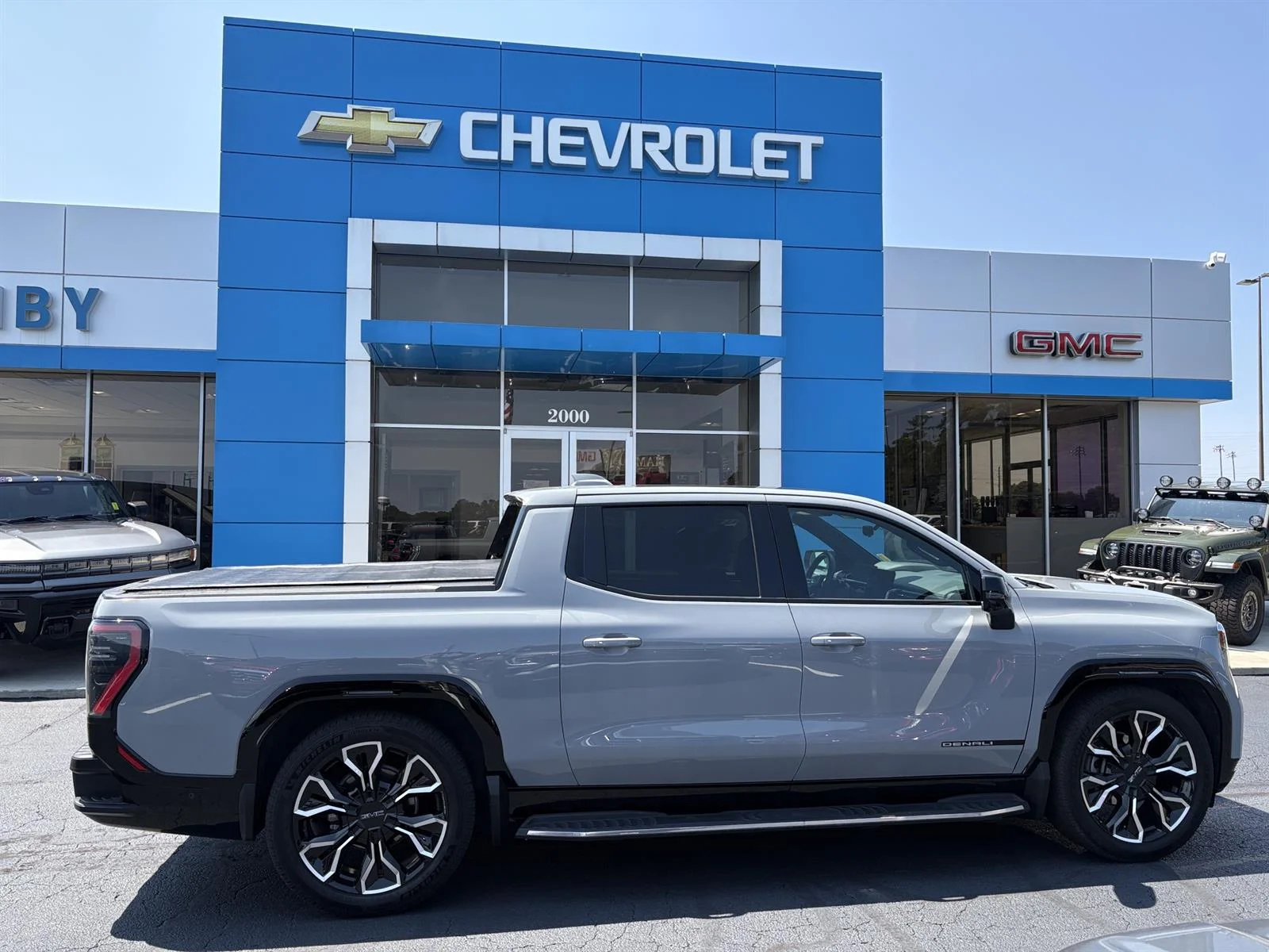 Used 2025 Thunderstorm Gray GMC Max Range Denali image 3