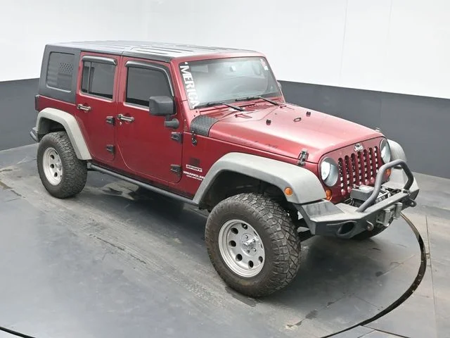 Used 2012 Red Jeep Unlimited Sport image 12