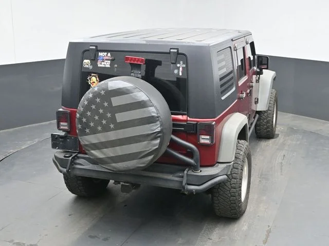 Used 2012 Red Jeep Unlimited Sport image 22
