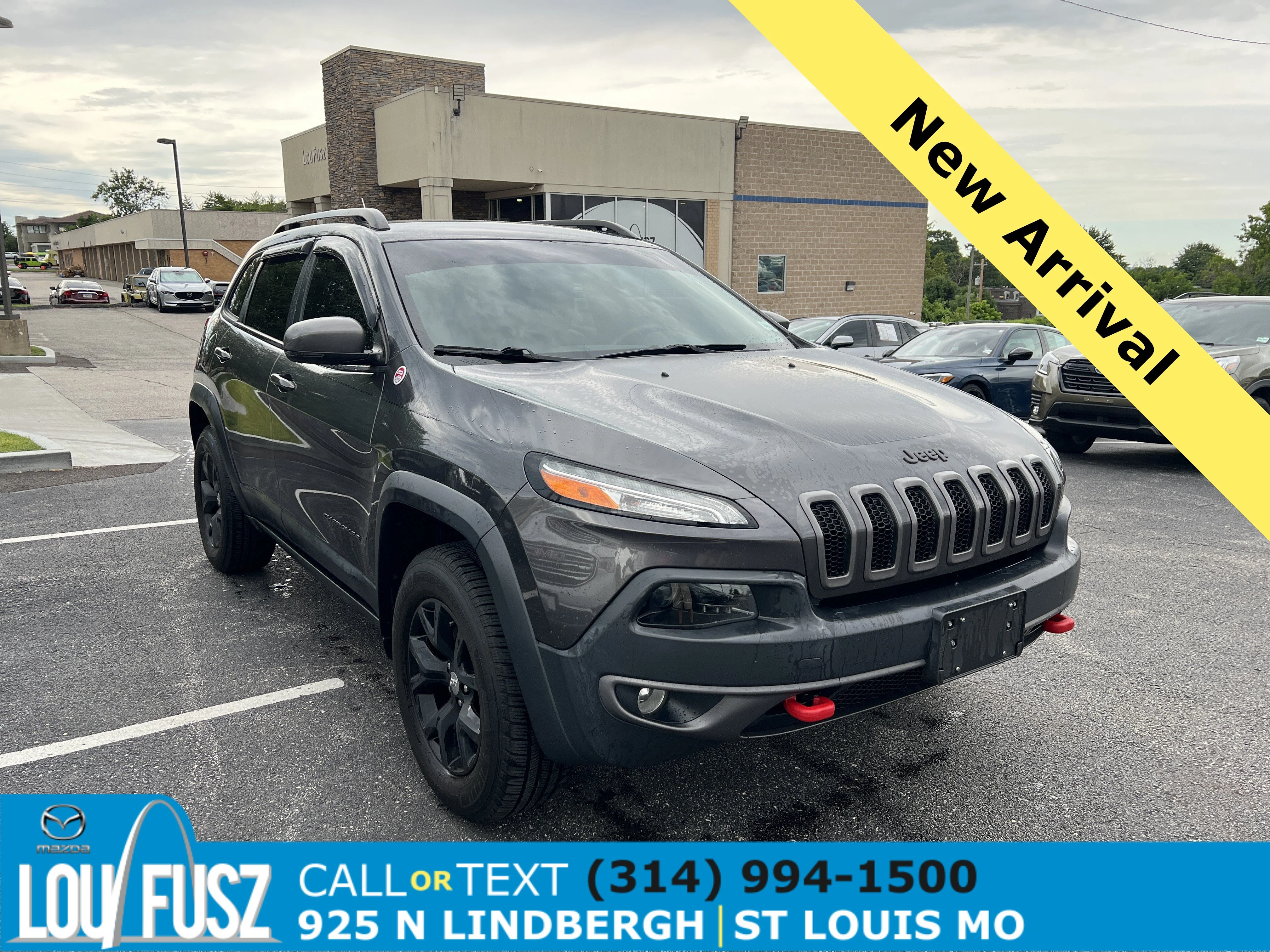 Used 2015 Granite Crystal Metallic Clearcoat Jeep Trailhawk image 1