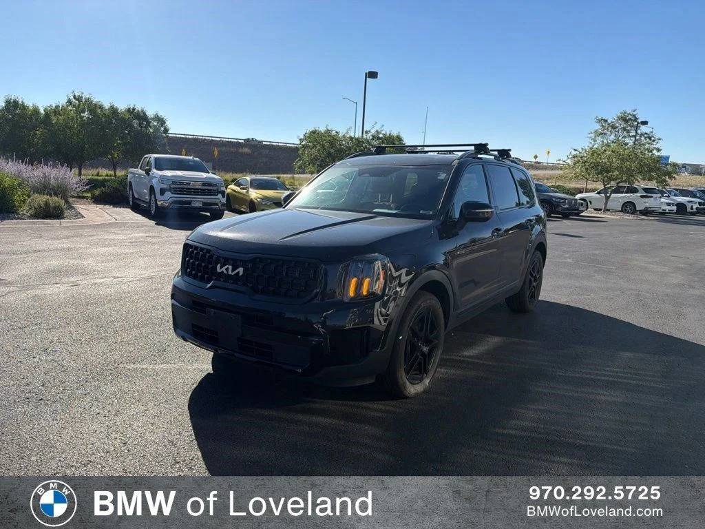 Used 2024 Ebony Black Kia EX X-Line image 1