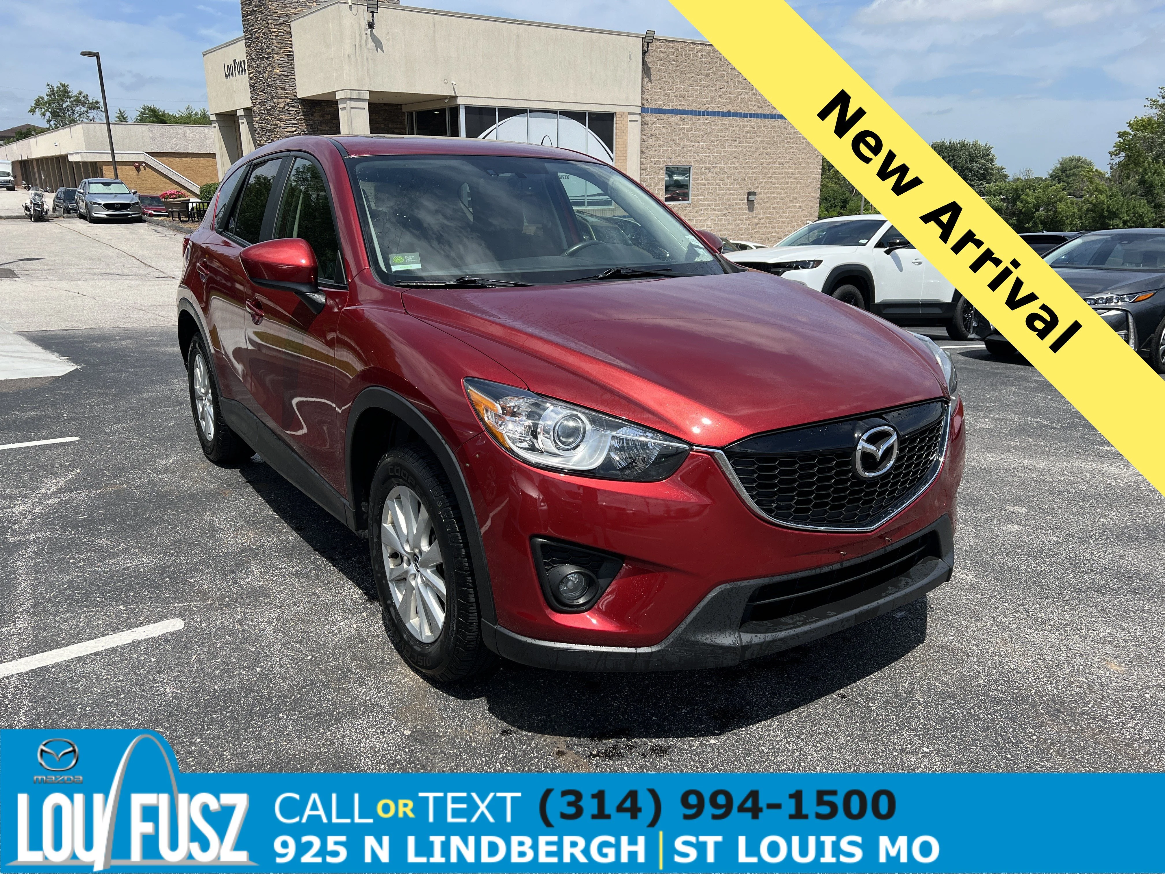 Used 2013 Zeal Red Mica Mazda Touring image 1