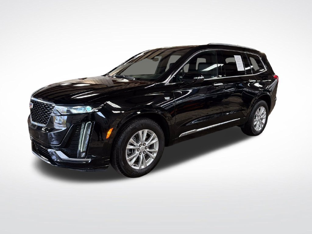Used 2024 Stellar Black Metallic Cadillac Luxury image 1