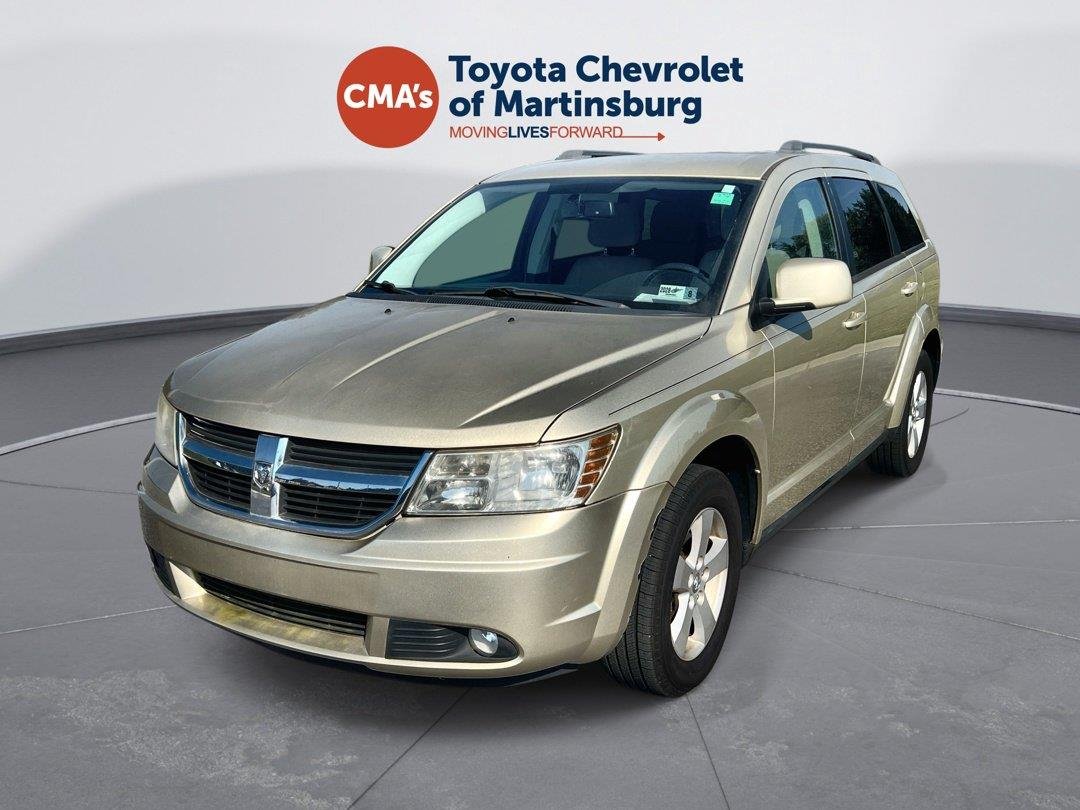 Used 2010 White Gold Dodge SXT image 1