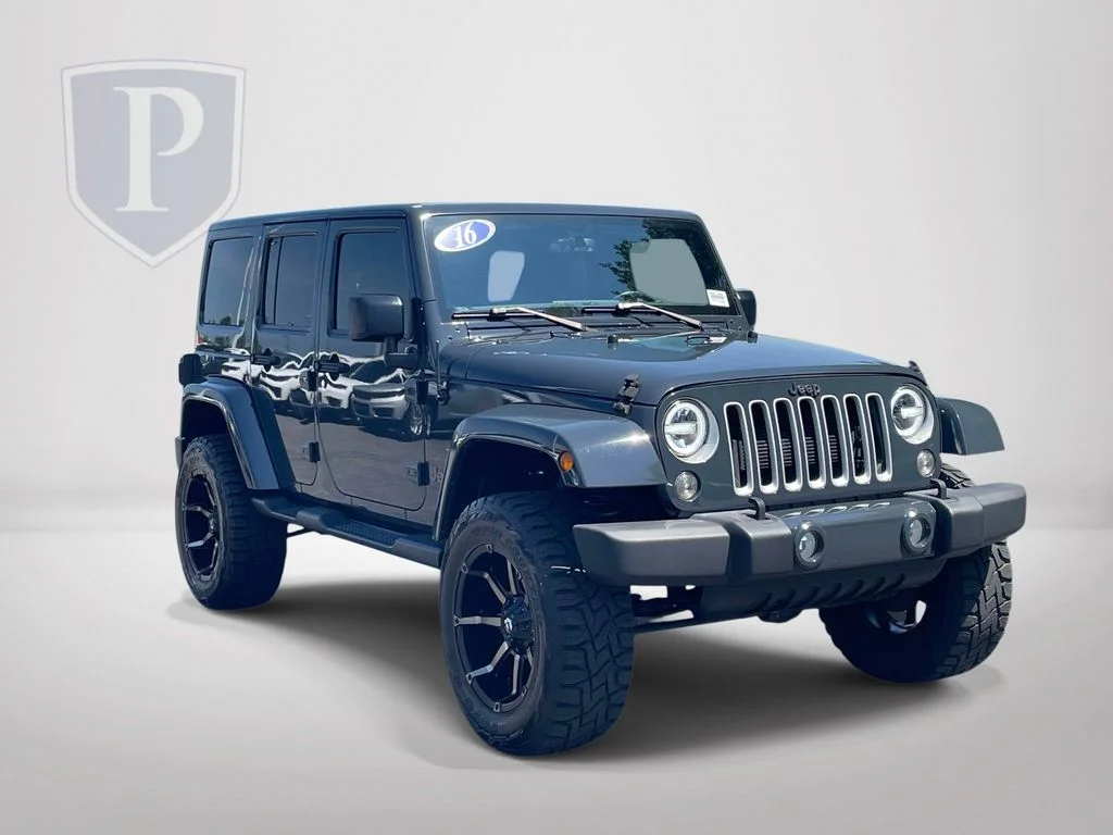 Used 2016 Black Jeep Unlimited Sahara image 1