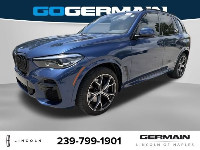 Used 2022 Blue BMW sDrive40i image 1