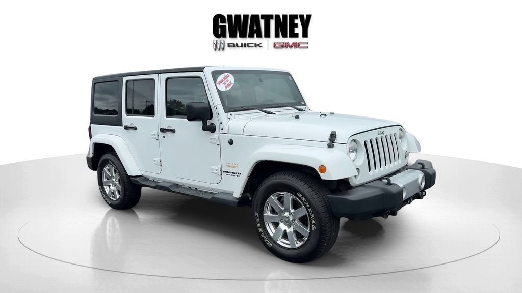Used 2014 White Jeep Sahara image 1