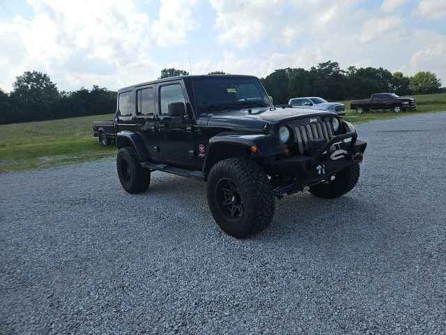 Used 2013 Black Jeep Unlimited Sahara image 4
