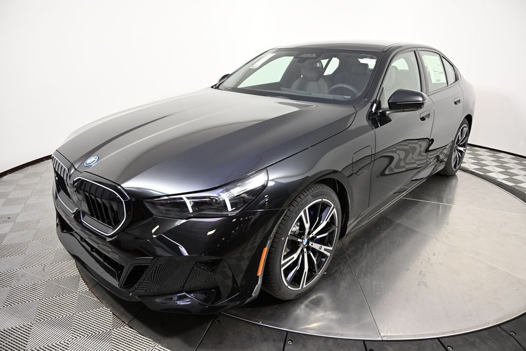 New 2027 Black Sapphire Metallic BMW 550e xDrive image 1