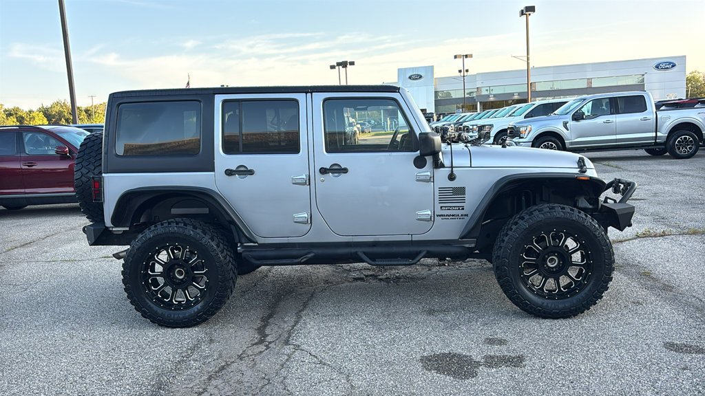 Used 2013 Billet Clearcoat Metallic Jeep Unlimited Sport image 22