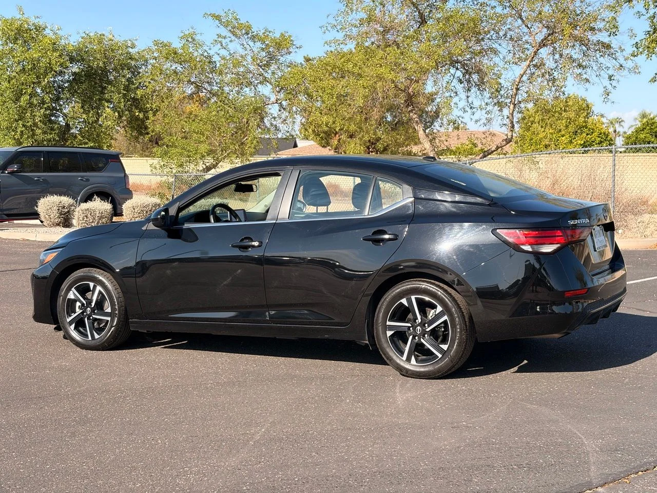 Used 2024 Super Black Nissan SV image 3