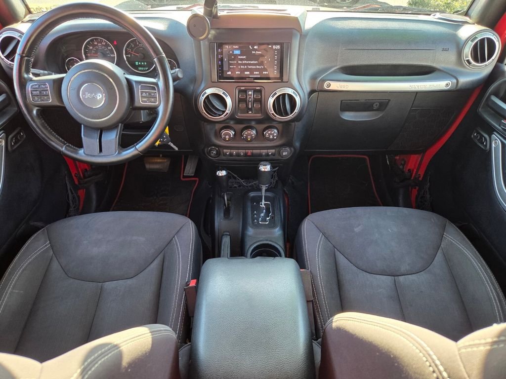 Used 2015 Red Jeep Unlimited Sahara image 14