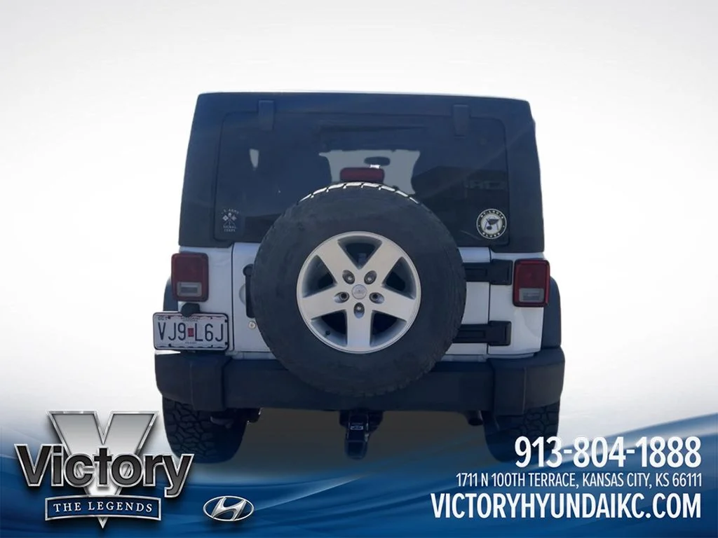 Used 2013 White Jeep Unlimited Sport image 6