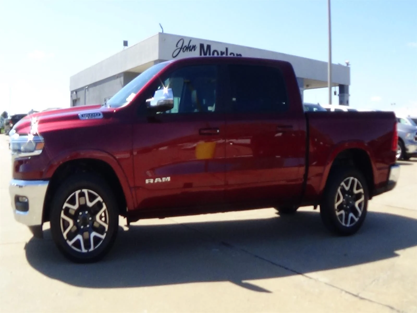 Used 2025 Delmonico Red Pearl Coat (prv) RAM Laramie image 1