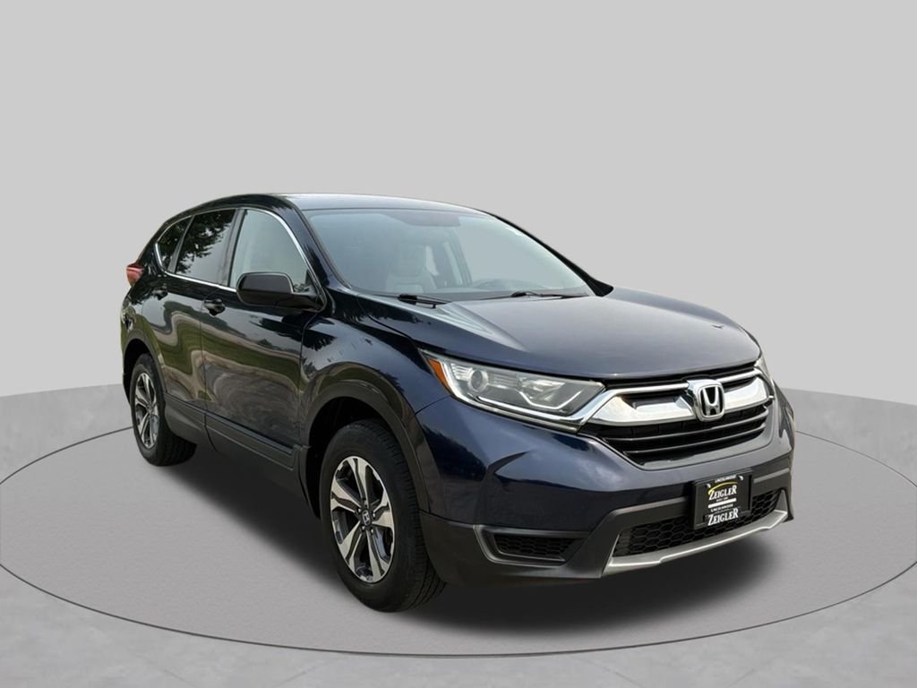 Used 2018 Honda CR-V LX with VIN 2HKRW6H3XJH210858 for sale in Lincolnwood, IL