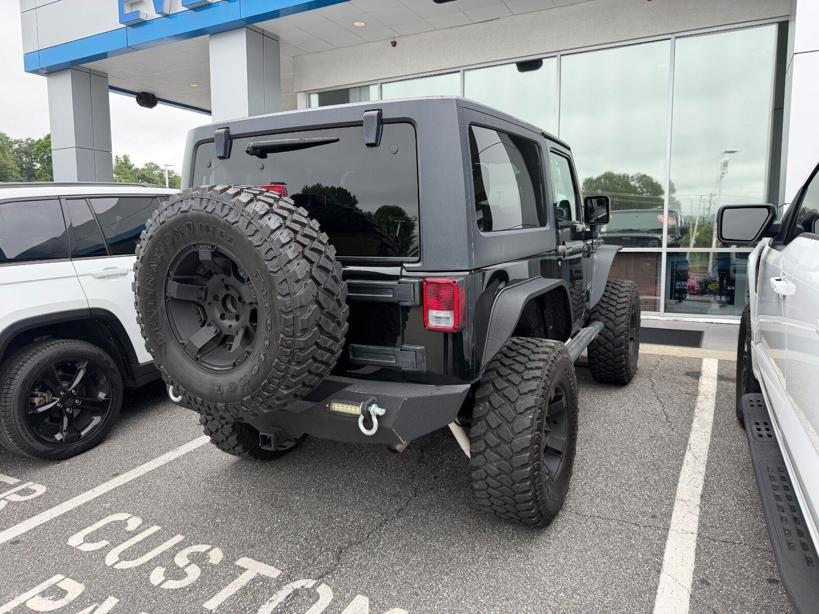 Used 2014 Black Clearcoat Jeep Sport image 4