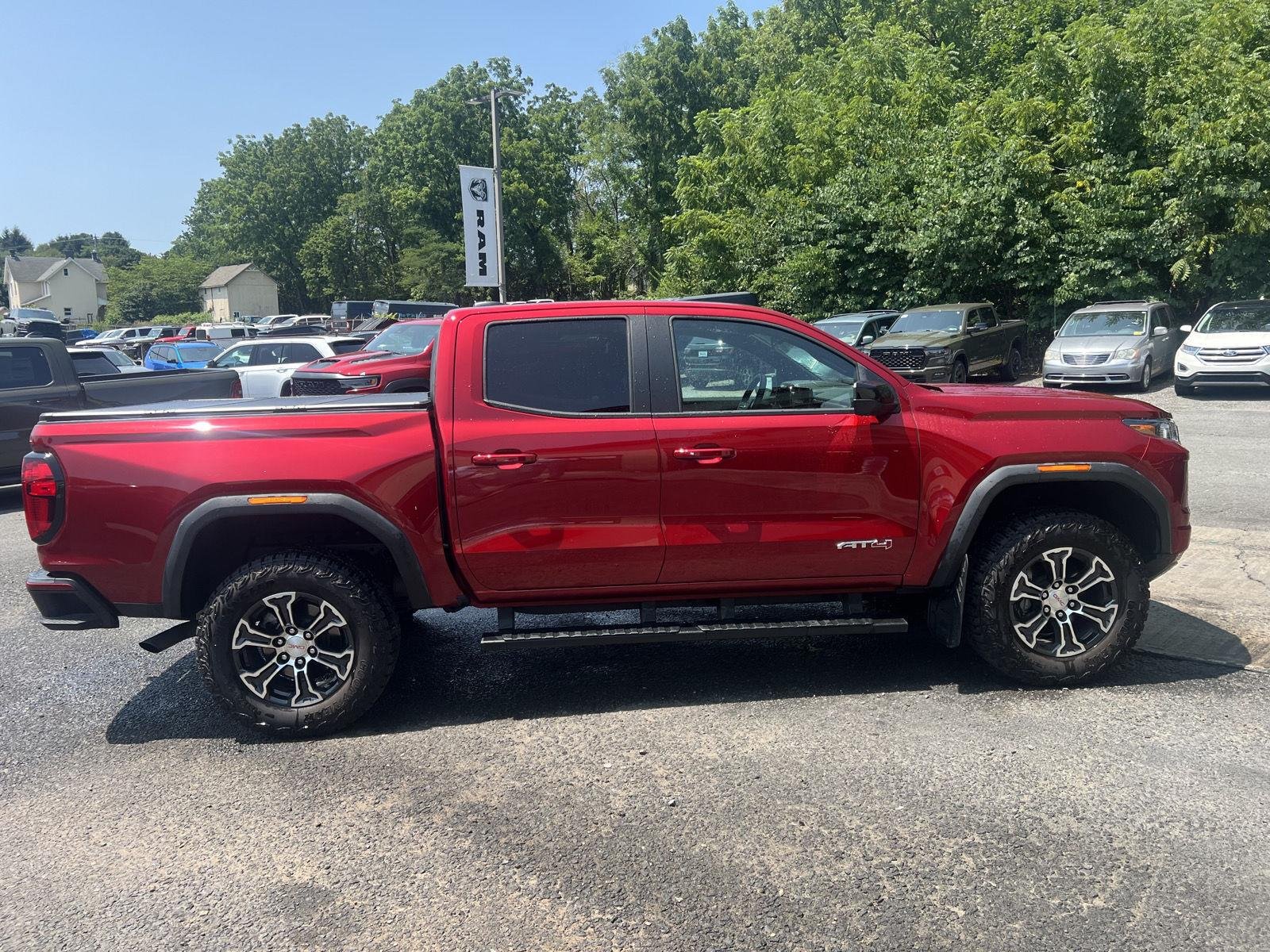 Used 2024 Volcanic Red Tintcoat GMC 4WD AT4 image 2