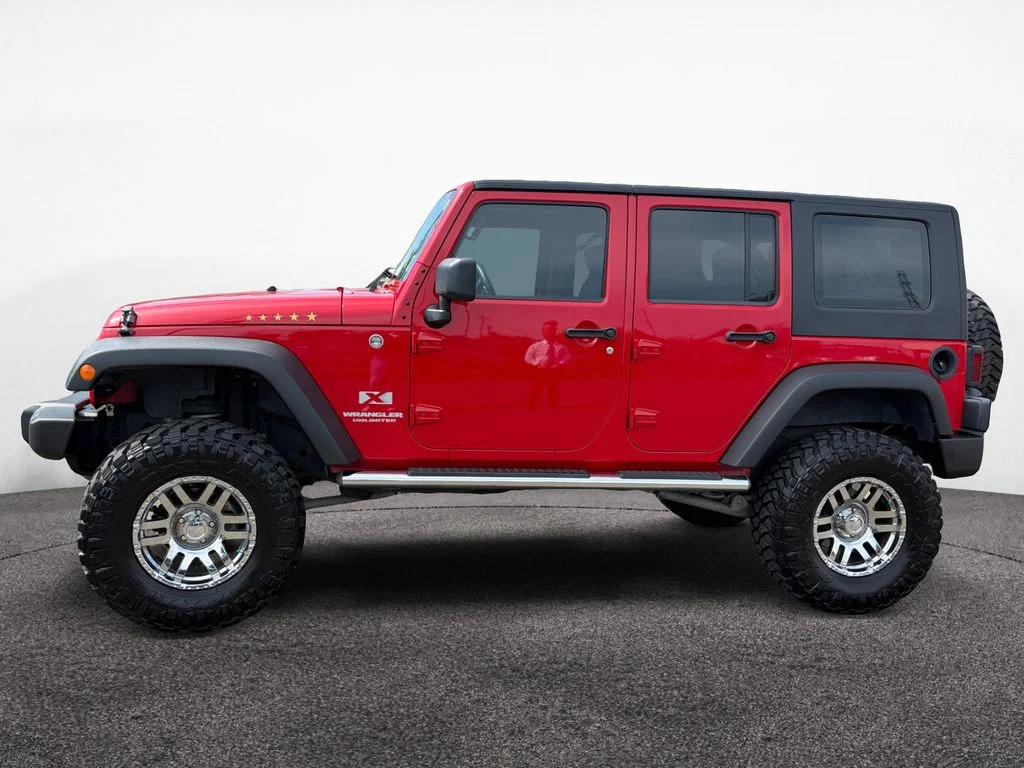Used 2009 Red Jeep Unlimited X image 2