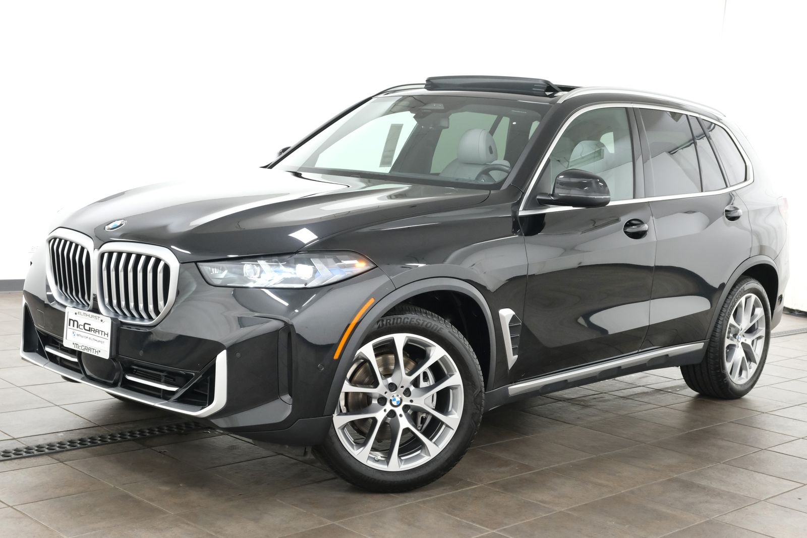 Certified Used 2024 Black Sapphire Metallic BMW xDrive40i image 1