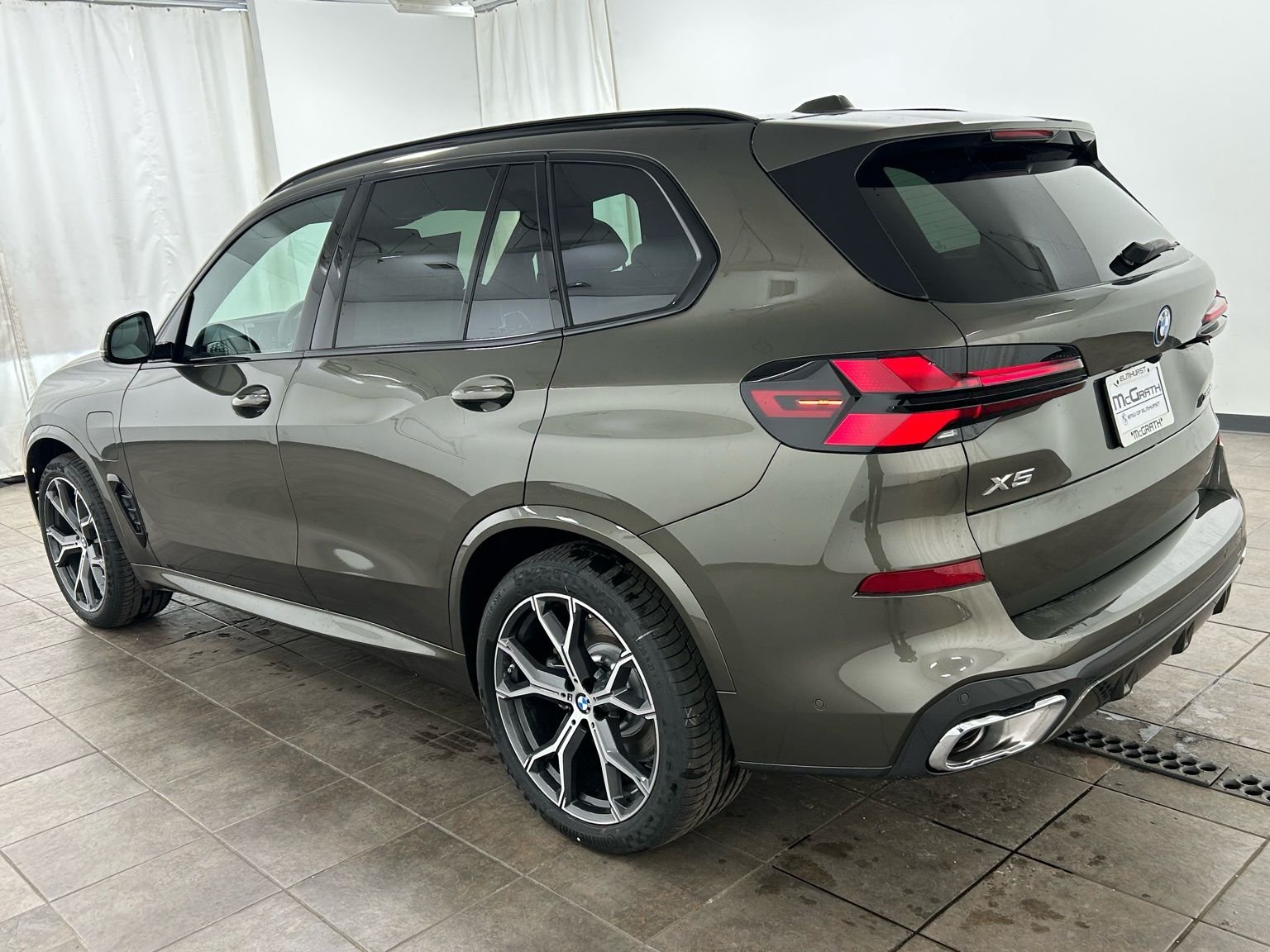 New 2026 Manhattan Green Metallic BMW xDrive50e image 3