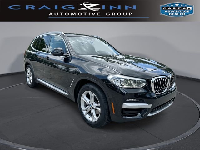 Used 2021 Black BMW sDrive30i image 1