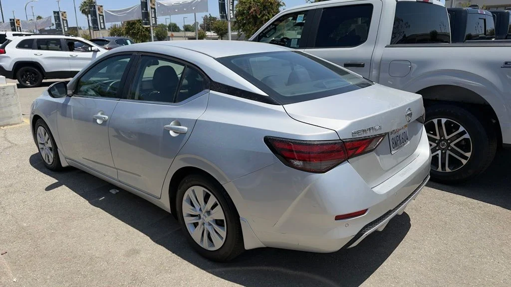 Used 2021 Brilliant Silver Metallic Nissan S image 4